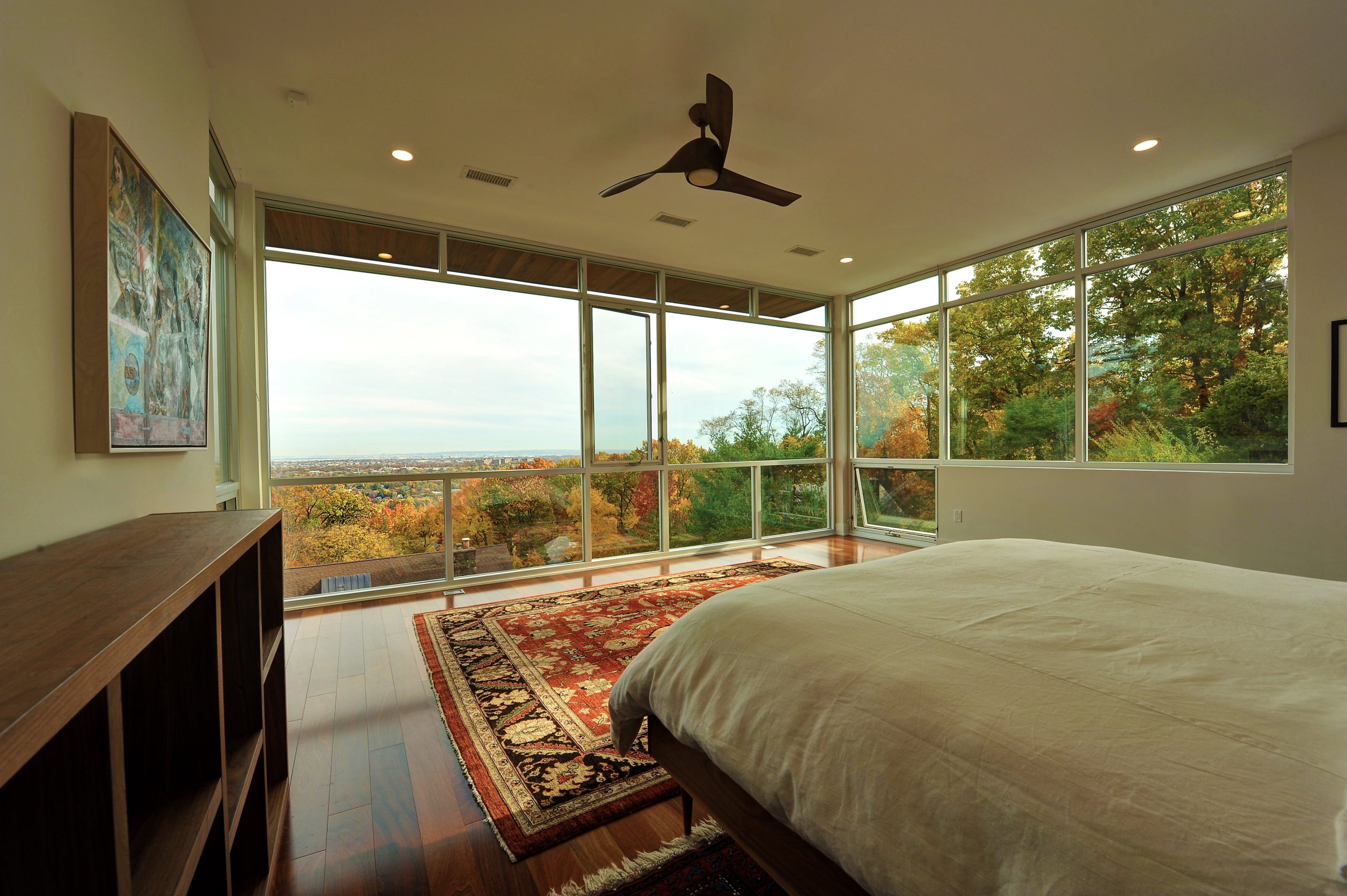 Master bedroom with glass walls and perfect view of nature | Premier Glass of New York
