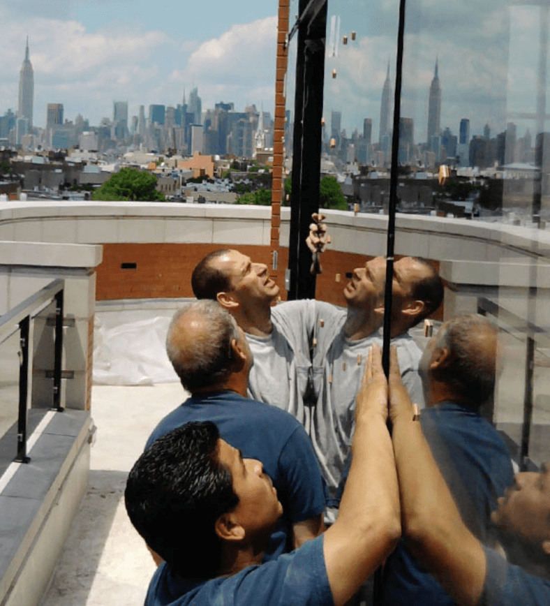 Three people working on glass replacement | Premier Glass of New York